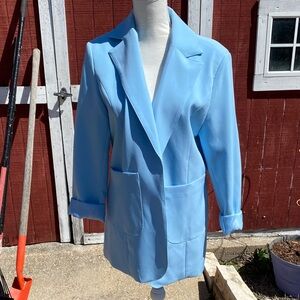 Light blue women’s blazer with shoulder pads